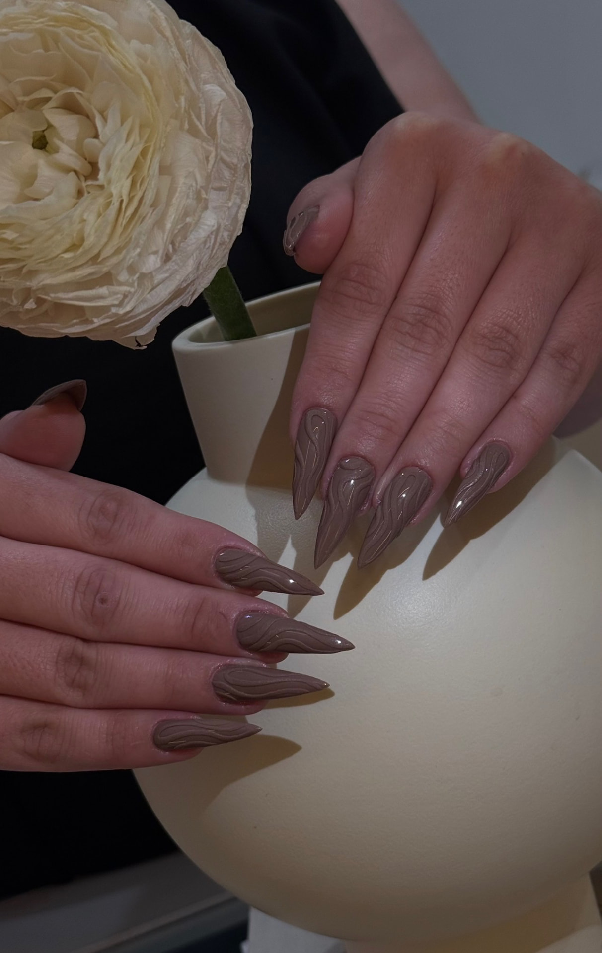 Mocha nude stiletto nails with 3D swirl art